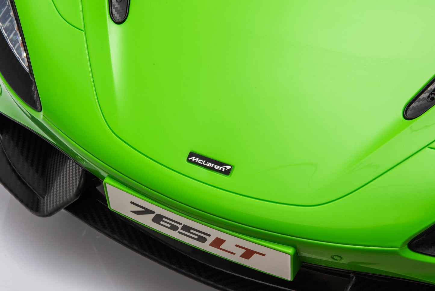 McLaren 765LT 12V Kids Ride-On Car in green with rubber tires, leather seat, LED lights, butterfly doors, parental remote control, and rechargeable battery.
electric-powered kids ride on car McLaren 765LT 12v