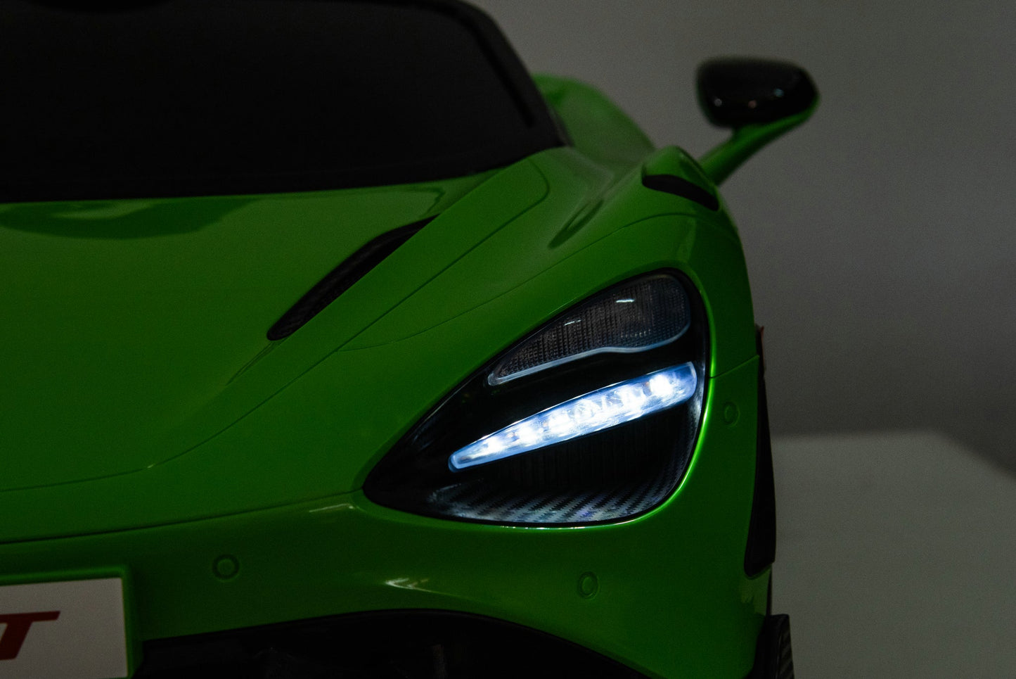 McLaren 765LT 12V Kids Ride-On Car in green with rubber tires, leather seat, LED lights, butterfly doors, parental remote control, and rechargeable battery.
electric-powered kids ride on car McLaren 765LT 12v