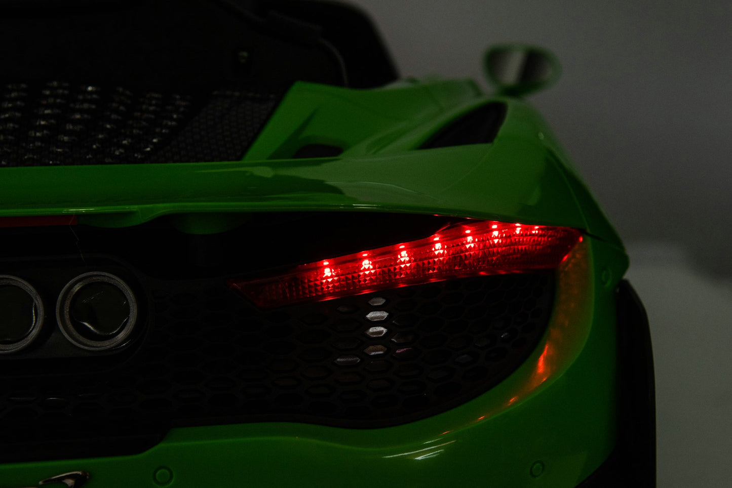 McLaren 765LT 12V Kids Ride-On Car in green with rubber tires, leather seat, LED lights, butterfly doors, parental remote control, and rechargeable battery.
electric-powered kids ride on car McLaren 765LT 12v