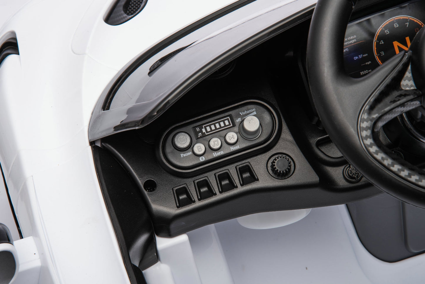 McLaren 765LT 12V Kids Ride-On Car in white with rubber tires, leather seat, LED lights, butterfly doors, parental remote control, and rechargeable battery.