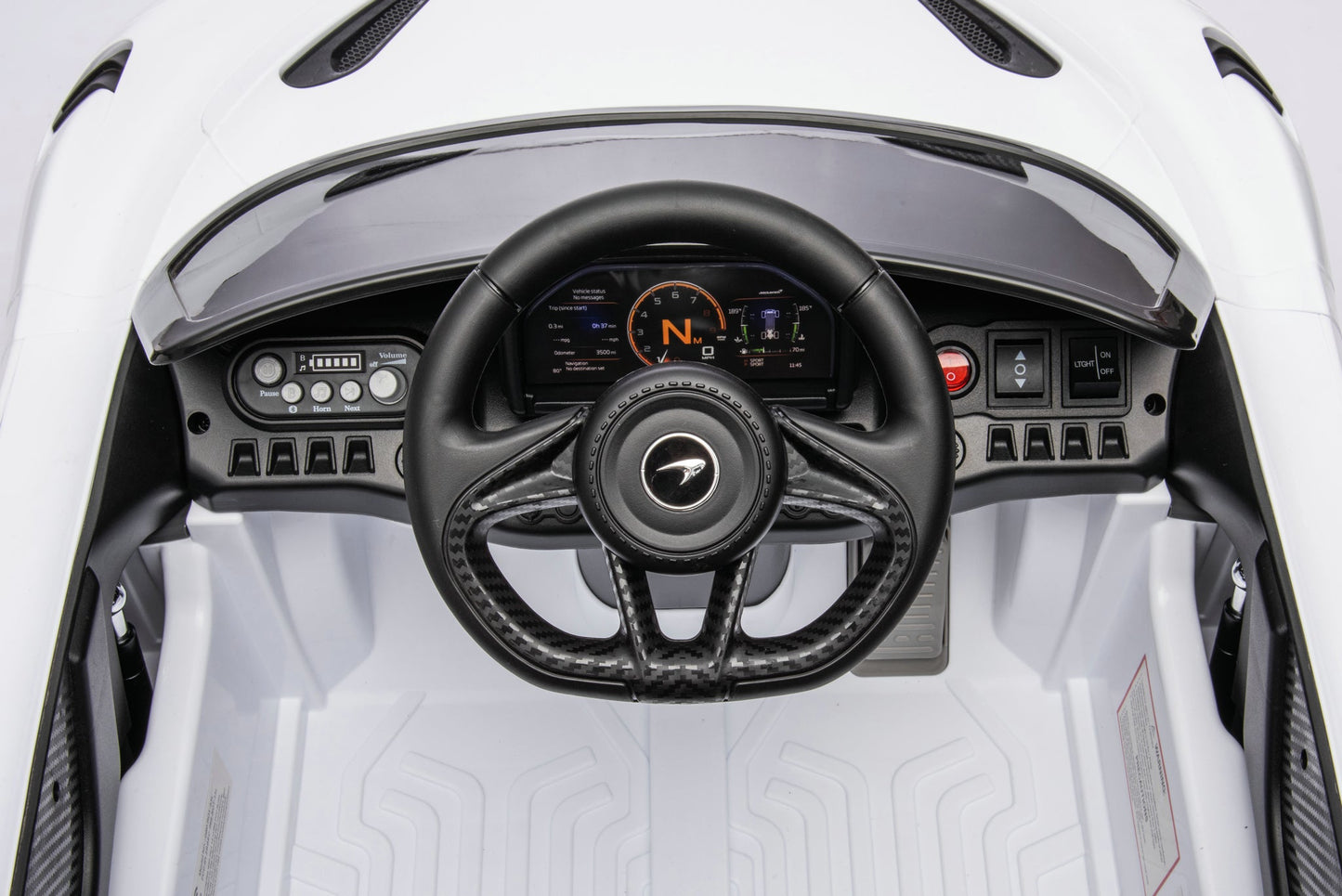 McLaren 765LT 12V Kids Ride-On Car in white with rubber tires, leather seat, LED lights, butterfly doors, parental remote control, and rechargeable battery.