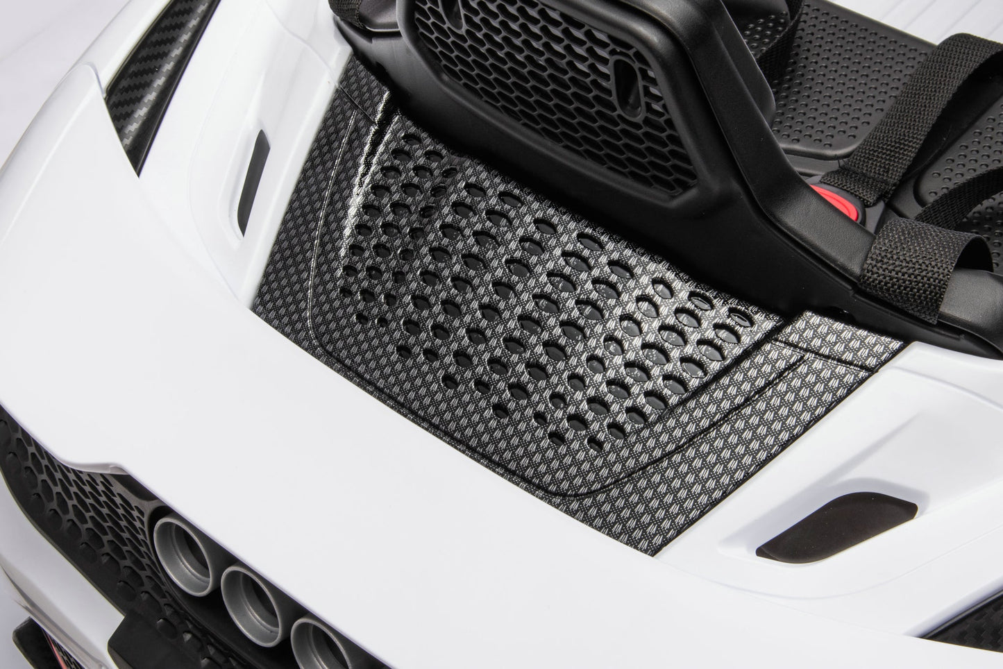 McLaren 765LT 12V Kids Ride-On Car in white with rubber tires, leather seat, LED lights, butterfly doors, parental remote control, and rechargeable battery.