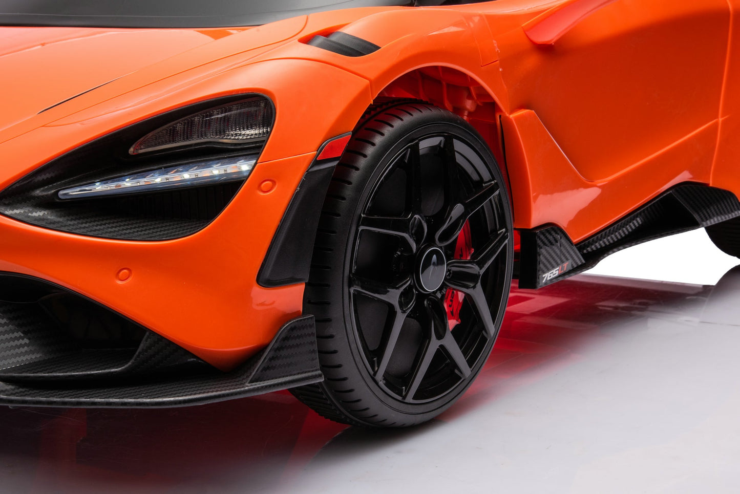 McLaren 765LT 12V Kids Ride-On Car in orange with rubber tires, leather seat, LED lights, butterfly doors, parental remote control, and rechargeable battery.
electric-powered kids ride on car McLaren 765LT 12v