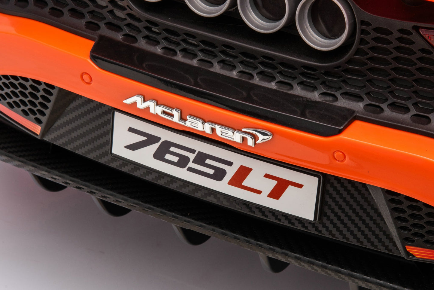 McLaren 765LT 12V Kids Ride-On Car in orange with rubber tires, leather seat, LED lights, butterfly doors, parental remote control, and rechargeable battery.
electric-powered kids ride on car McLaren 765LT 12v