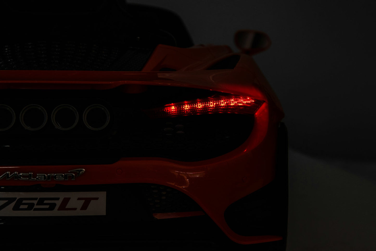 McLaren 765LT 12V Kids Ride-On Car in orange with rubber tires, leather seat, LED lights, butterfly doors, parental remote control, and rechargeable battery.
electric-powered kids ride on car McLaren 765LT 12v