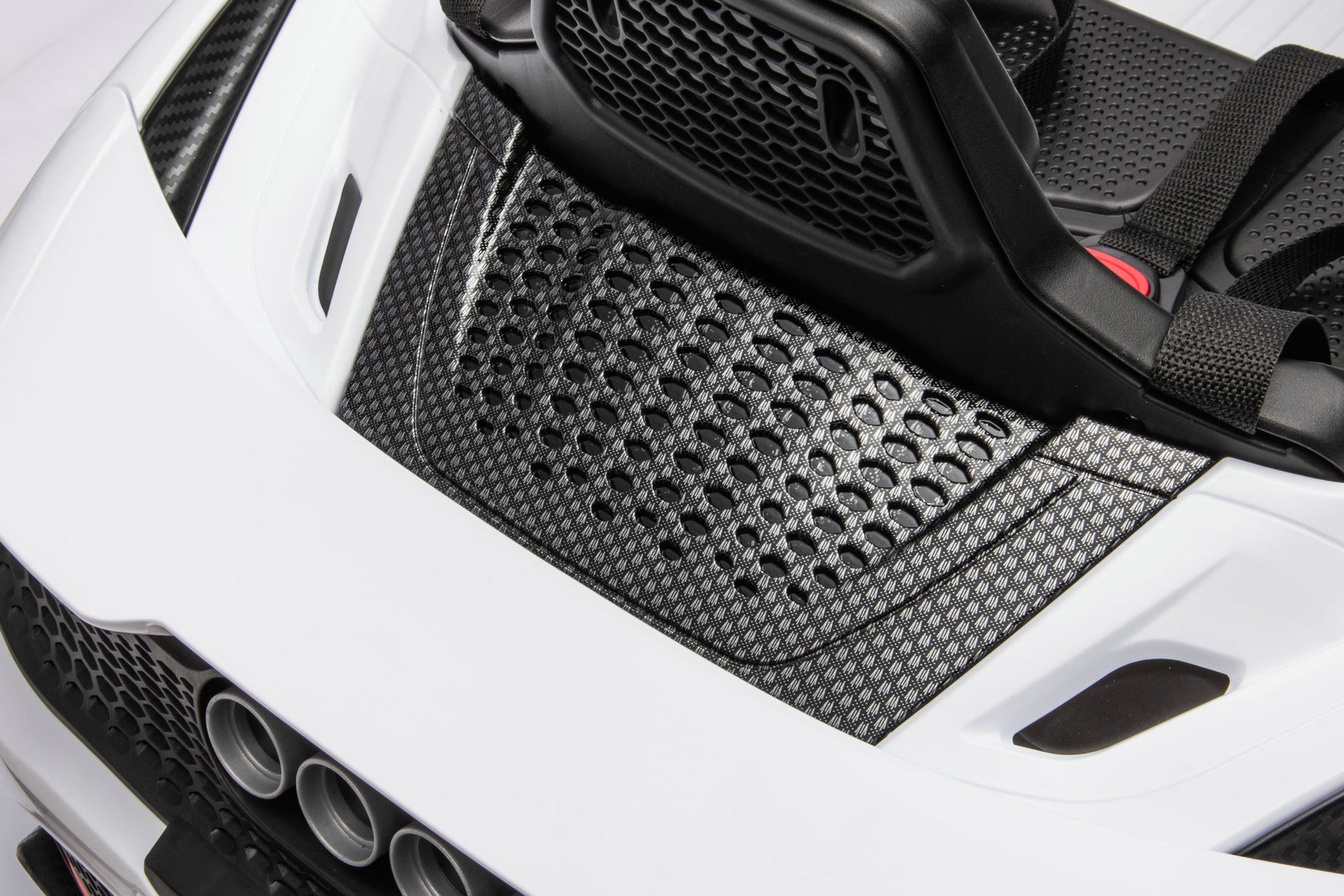 McLaren 765LT 12V Kids Ride-On Car in white with rubber tires, leather seat, LED lights, butterfly doors, parental remote control, and rechargeable battery.
