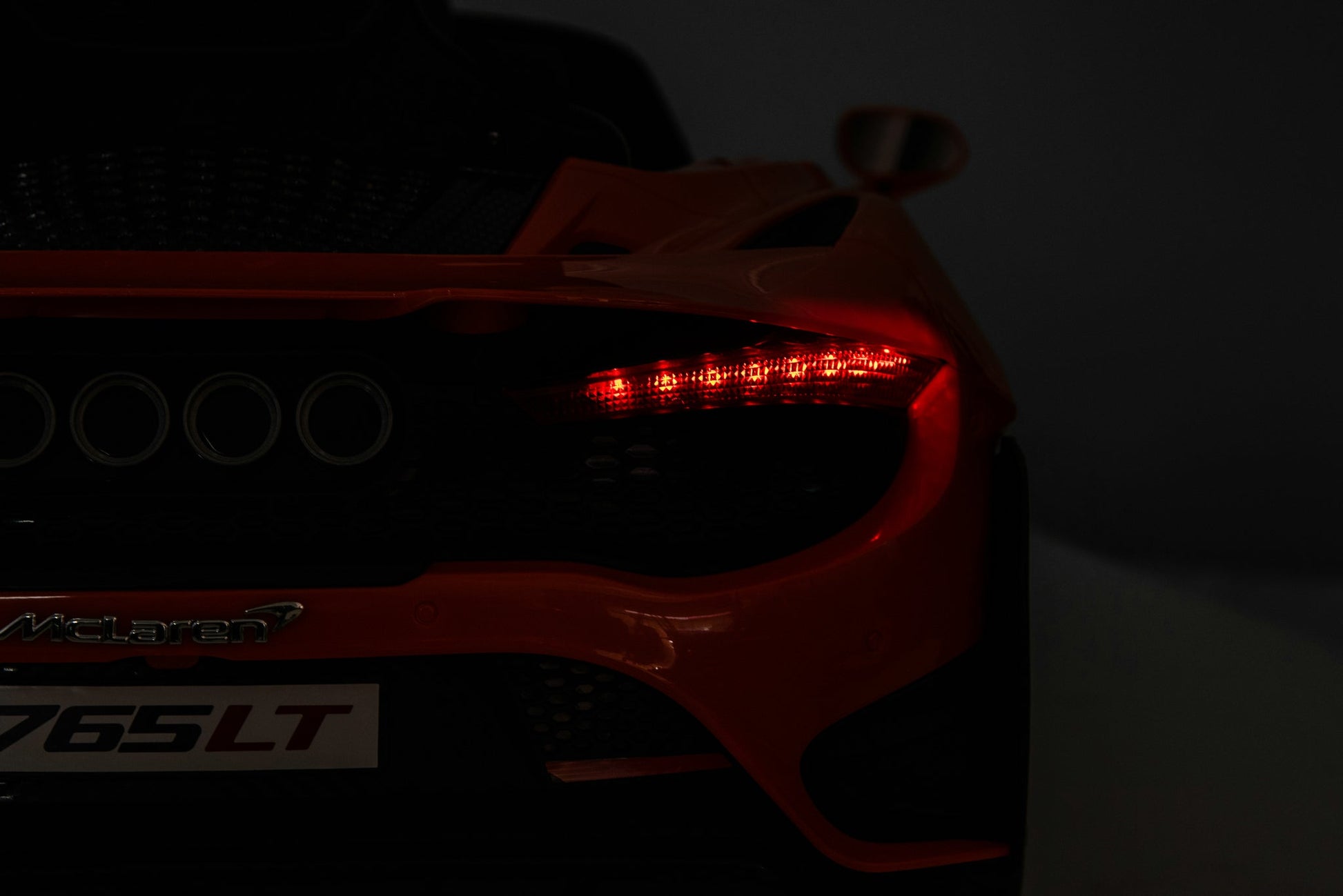 McLaren 765LT 12V Kids Ride-On Car in orange with rubber tires, leather seat, LED lights, butterfly doors, parental remote control, and rechargeable battery.
electric-powered kids ride on car McLaren 765LT 12v
