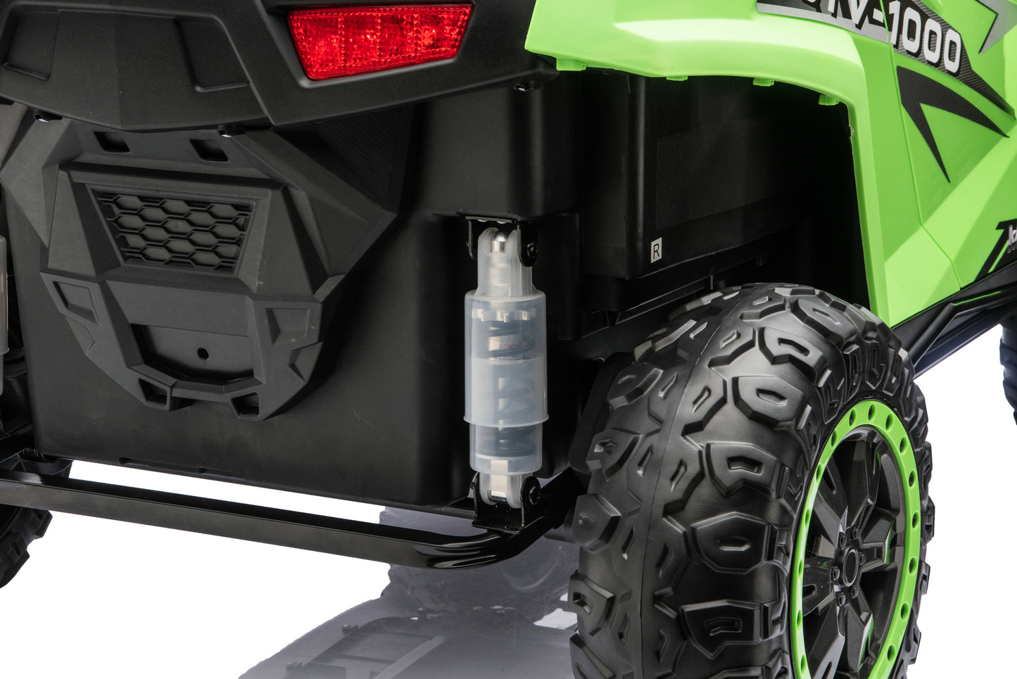 Close-up of the rubber tires on the Apex XXL 24V ride-on UTV.