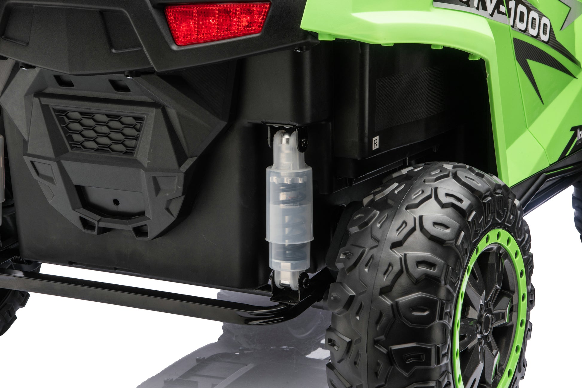 Close-up of the rubber tires on the Apex XXL 24V ride-on UTV.