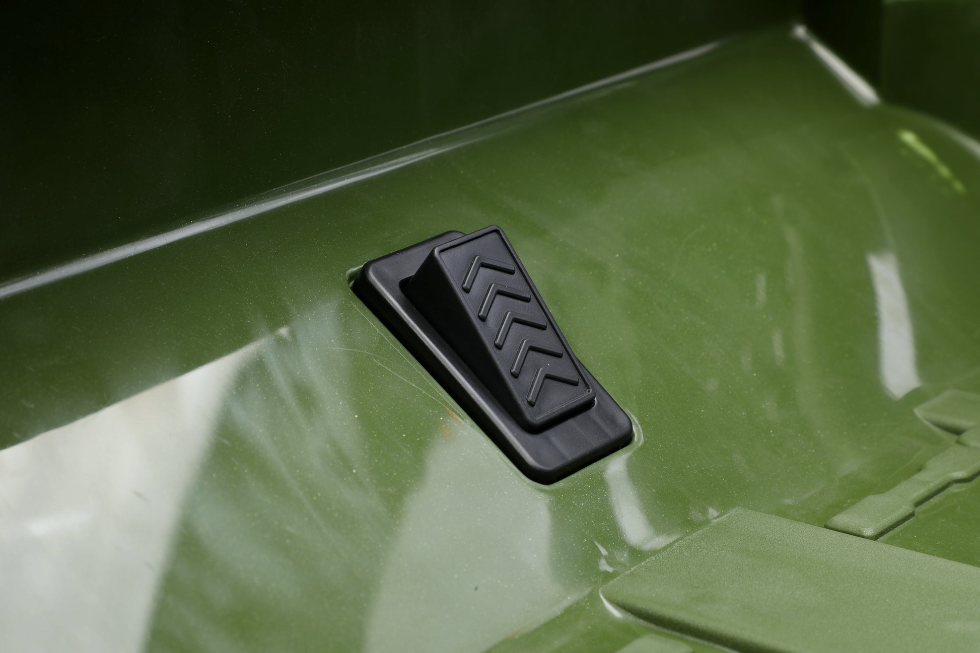 A close-up of a accelerator pedal for kids toy jeep 24v