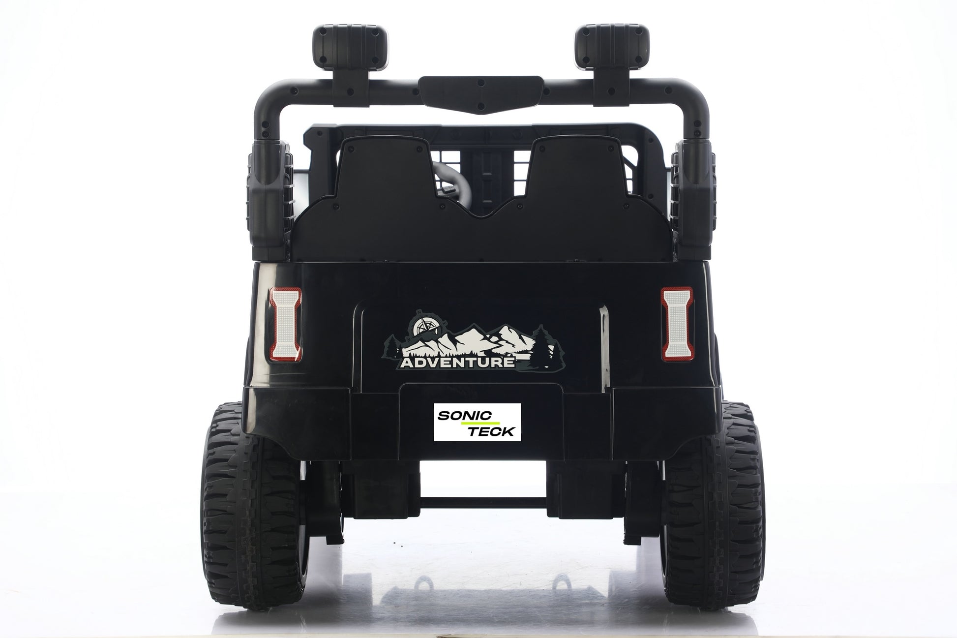 Black Sonio Teck kids' ride-on vehicle shown from the rear view, featuring dual seats, roll bar, and rugged tires on a white background.